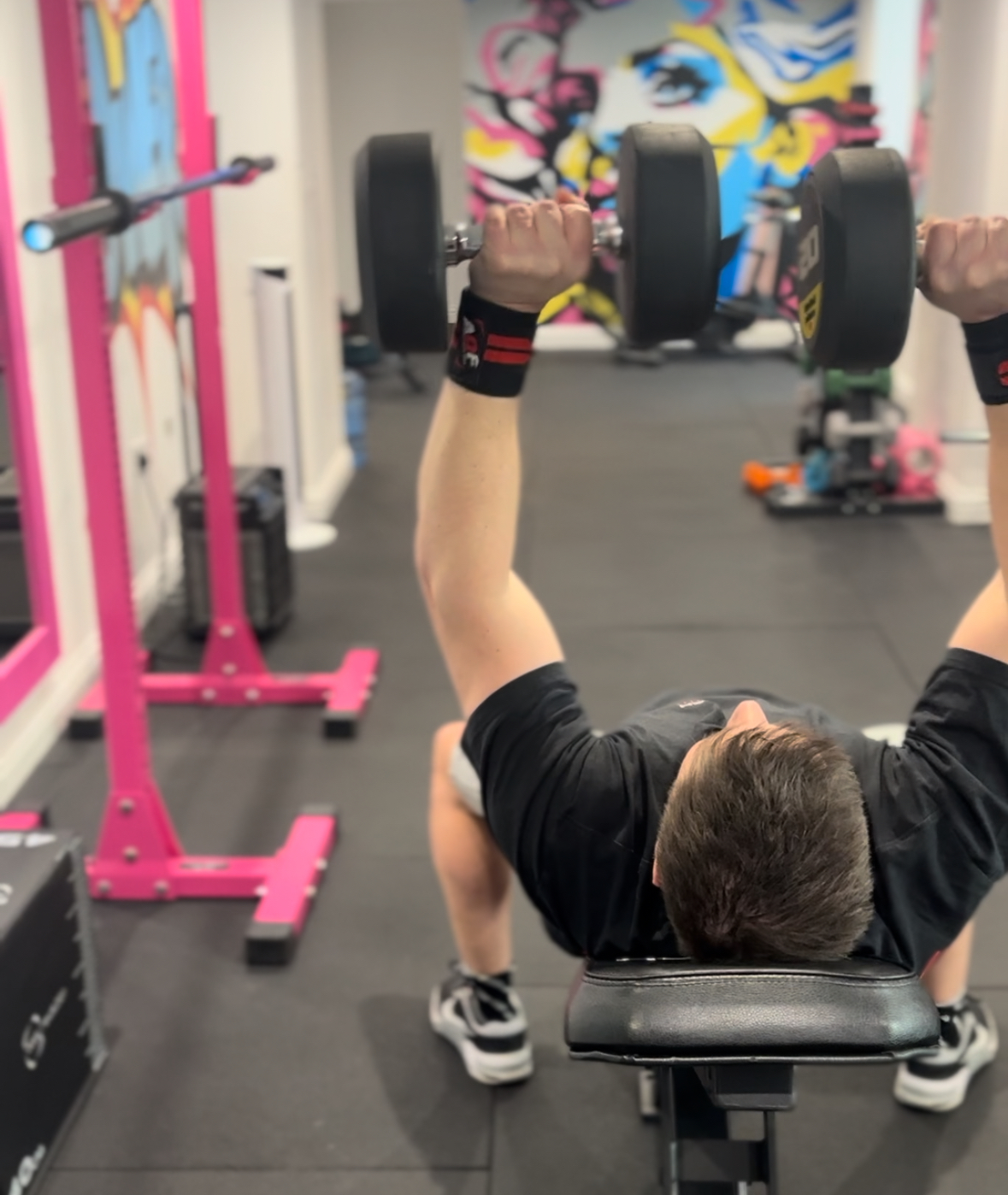 Client swinging a kettlebell during training